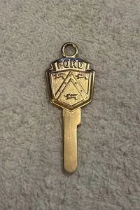 🔥De colección Lofink MTR CO. Nueva York Ford Lions Crest llave de coche en blanco dorado sin cortar NY - Imagen 1 de 12