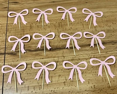 Lazo rosa, cinta de coqueta, femenina, lindos adornos para cupcakes Foto 1 de 3