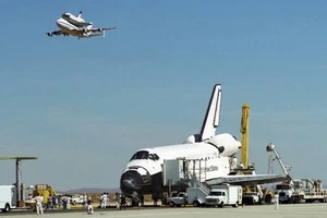New 5x7 NASA Photo: Space Shuttle Endeavour on Runway with Columbia Overhead - Picture 1 of 1