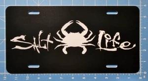 Placa de licencia de cangrejo de refuerzo Salt Life Signature - salada viva - negra - totalmente nueva - Imagen 1 de 2