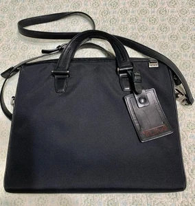 Tumi Black Shoulder Tote Bag Handles Red Lining ID Fob Laptop Zip - Picture 1 of 9