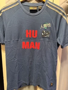 CAMISETA ADIDAS PHARRELL WILLIAMS RAZA HUMANA - BJ9086 - AZUL - TALLA MEDIANA - Imagen 1 de 7