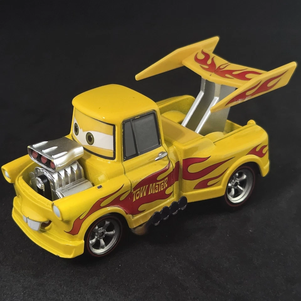 Disney Pixar Cars Funny Car Mater Loose Diecast Yellow Flames  - Image 1 of 4