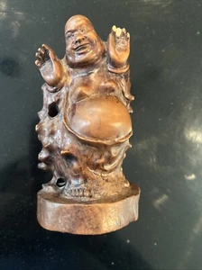 Wooden carved monk with figures crawling on him. - Picture 1 of 5