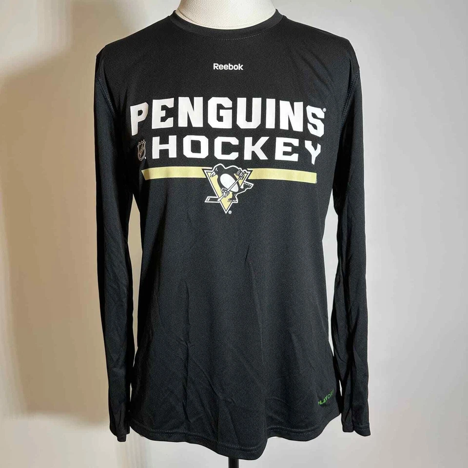 NUEVO CON ETIQUETAS Pittsburgh Penguins Reebok Play Dry Camisa Manga Larga Juvenil Talla Grande 14-16 Foto 1 de 4