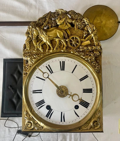 COMTOISE CLOCK WITH 4 BELLS. EMBOSSED BRASS. FRANCE. XIX CENTURY Cover