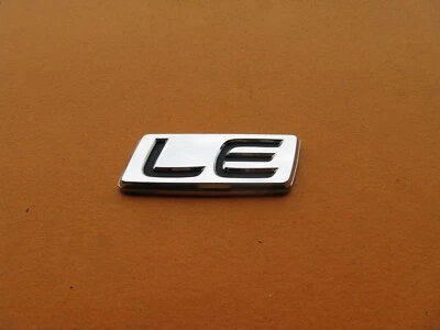 03 04 05 06 07 08 TOYOTA COROLLA LE REAR CHROME EMBLEM LOGO BADGE SIGN A39250 - Image 1 of 2