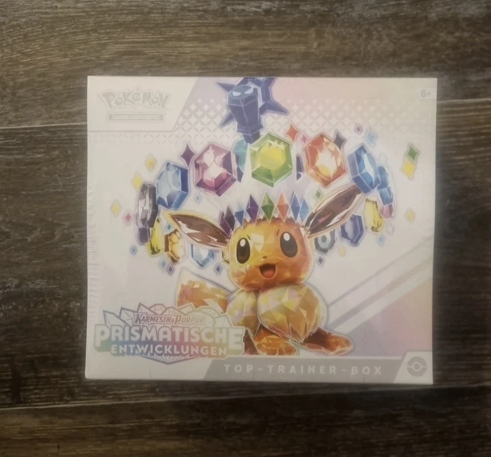 Pokemon Prismatische Entwicklungen Top Trainer Box Deutsch Neu & OVP - Bild 1 von 1