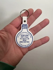Portachiavi vintage Star Line Mackinac Island MI idroplano barca giro fob lampadina  - Foto 1 di 2