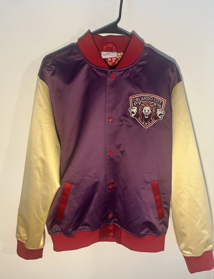 Chaqueta ligera para hombre Orlando City SC Mitchell & Ness púrpura 10 aniversario Foto 1 de 4