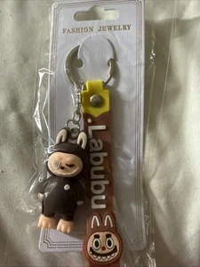 Mono Little Monsters marrón y correa de silicona marrón nuevo con etiquetas ojo dañado - Imagen 1 de 6