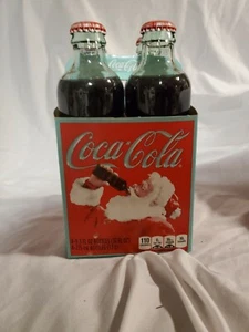 2011 COCA COLA Property Of CHRISTMAS HOLIDAY 4 PACK 9.3oz FULL BOTTLES COKE New - Picture 1 of 4