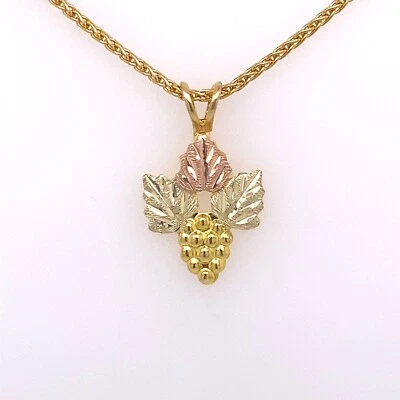10KT BLACK HILLS GOLD GRAPE LEAF CLUSTER PENDANT .5 GRAMS - Image 1 of 4
