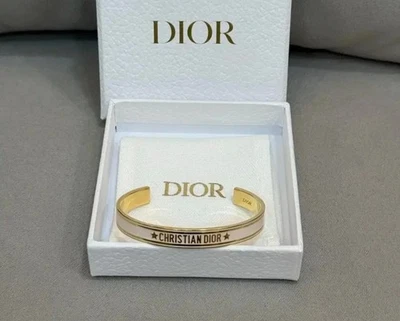 Brazalete código Dior dorado y blanco Foto 1 de 4