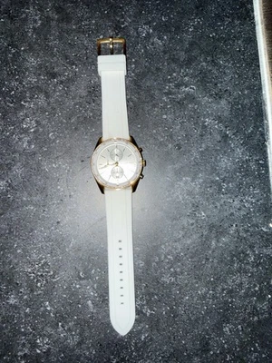Michael Kors Oversized Hadyn Pavé Gold-Tone Watch with a white silicone strap - Image 1 of 4