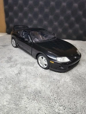 Литая модель автомобиля Kyosho Toyota Supra MK4 JZA80 масштаб 1:18 черная - Изображение 1 из 4