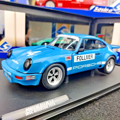 SOLIDO PORSCHE 911 IROC BLUE #4 FOLLMER IROC RIVERSIDE 1974 1:18 S1810702 NUO... - Immagine 1 di 4