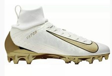 white football cleats with gold bottom