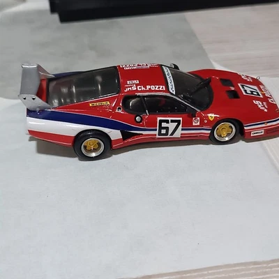 1:43 AMR TRON FERRARI 512 BB rossa con righe blu e bianche	team pozzi france - Immagine 1 di 4