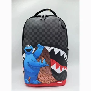 ZAINO SPRAYGROUND SESAME STREET COOKIE MONSTER SNEAKING A BITE DLXSV - Foto 1 di 2