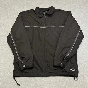 Chaqueta cortavientos vintage Y2K Oakley Software negra tecnología con cremallera/ligera talla XL - Imagen 1 de 7