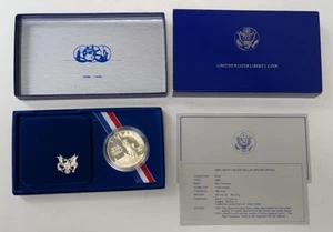 Moneta argento US Liberty 1986 prova di dollaro con scatola e certificato di autenticità - Foto 1 di 6