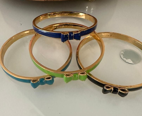 4 braccialetti Kate Spade proprietari