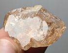 Natural gemmy light champagne color topaz with partial crystal faces