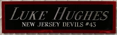 LUKE HUGHES NJ DEVILS NAMEPLATE FOR AUTOGRAPHED Signed STICK JERSEY PHOTO PUCK - Image 1 of 4