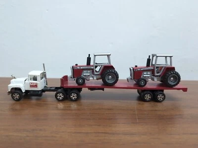 Ertl 1/64 Trucks of the World Mack Flatbed W/(2) Massey Ferguson Tractors  - Image 1 of 4