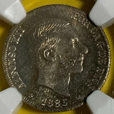 SPAIN PHILIPPINES TEN CENTAVO 1885 ALFONSO XII NGC MS 65 BEAUTIFUL TONING - Image 1 of 4