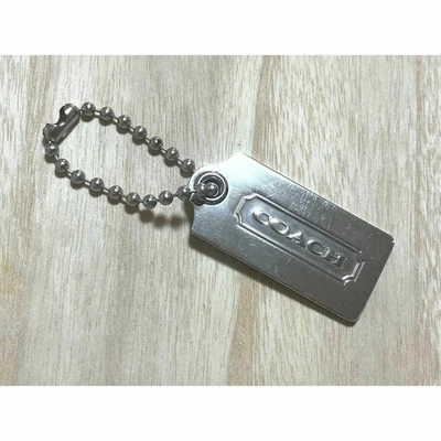 Portachiavi Coach con logo in metallo argento usato - Immagine 1 di 4