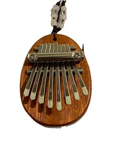 NUEVO Mini 8 Teclas Kalimba Pulgar Piano Sonido Dedo Teclado Musical Juguete de Mano y Caja - Imagen 1 de 8