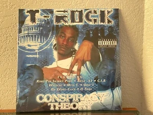 T-Rock - Conspiracy Theory - Blue Vinyl Record - Rare 1 of 150 made SEALED new - Imagen 1 de 2