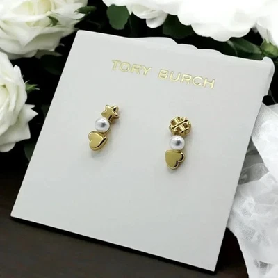 Escaladores de oreja Tory Burch Kira chapados en oro de 18 quilates y perlas de imitación. Foto 1 de 4