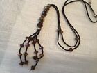 Sparkling golds Amber  brown blue pendant necklace on soft brown cord