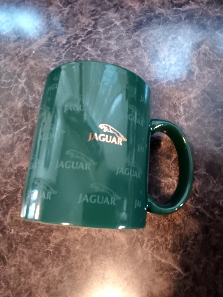 Taza vintage con logotipo de gato saltando oro verde bosque cerámica jaguar Foto 1 de 1
