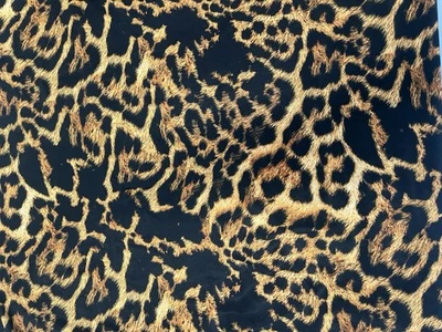 Tela de jersey ajustada con estampado de leopardo negro y marrón 143 cm Foto 1 de 4