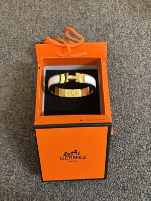 Pulsera Hermes Clic H Blanco y Oro Foto 1 de 4