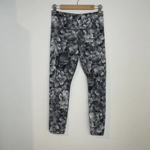 Leggings ajustados elásticos texturizados elásticos elásticos florales Athleta $109 talla M 7/8 - Imagen 1 de 11