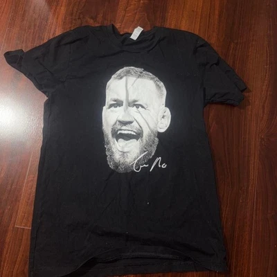 Camiseta negra hombre conor mcgregor blanco y negro Foto 1 de 2
