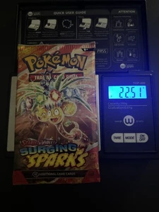 ¡PESADO! Paquete de refuerzo de 22,51 g Surging Sparks Pokemon TCG - Imagen 1 de 5