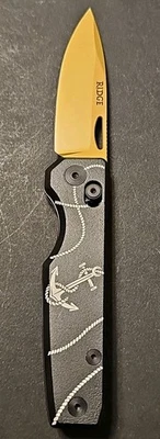 Carpeta diaria Ridge "Jolly Roger" cuchillo dorado 14C28N hoja con caja y bolsa Foto 1 de 4