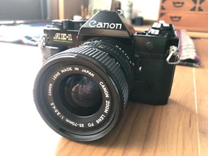 [tal cual] Canon AE-1 Program SLR negra y nueva cámara fotográfica FD 35-70 mm f/3,5-4,5 - Imagen 1 de 24