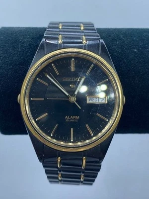 Reloj para hombre Seiko Alarm 34 mm WR cuarzo esfera negra/dorada acero inoxidable 65 g Foto 1 de 4