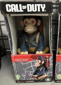Call of Duty Monkey Bomb Cable Guys - Mobile Phone and Gaming Controller Holder - Picture 1 of 1