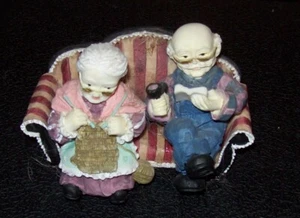 grandma and grandpa sitting on coach - Picture 1 of 3