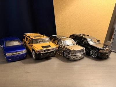 JADA Toys DUB City Diecast Car Lot 1:24 Navigator, Escalade, Hummer, Silverado  - Image 1 of 4