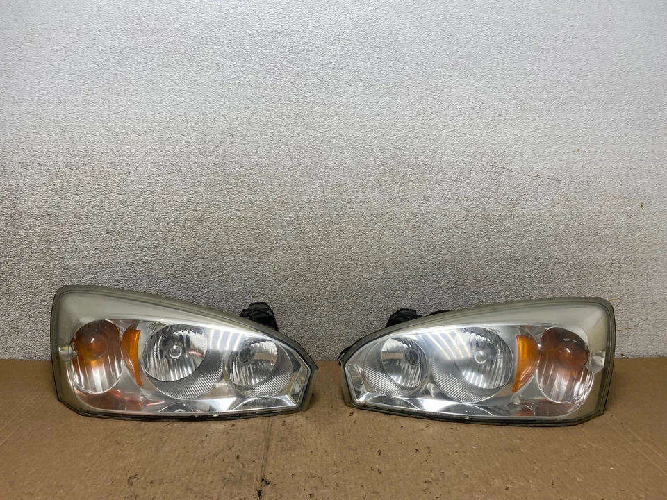 Juego de faros izquierdo+derecho Chevrolet Malibu 2004 a 2007 V3092 DW Foto 1 de 4