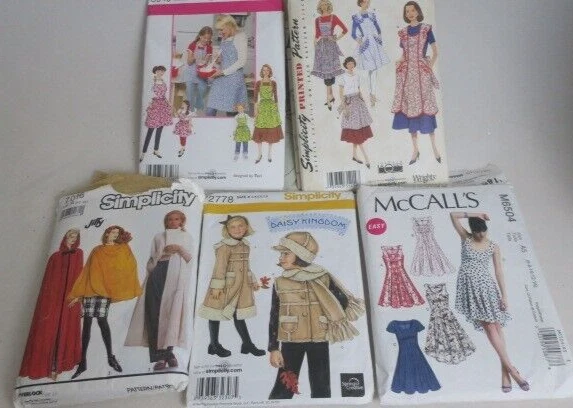  Sewing Patterns Lot of 5 Uncut Pre-Owned  Daisy Kingdom Aprons Dress Cape - Image 1 of 4